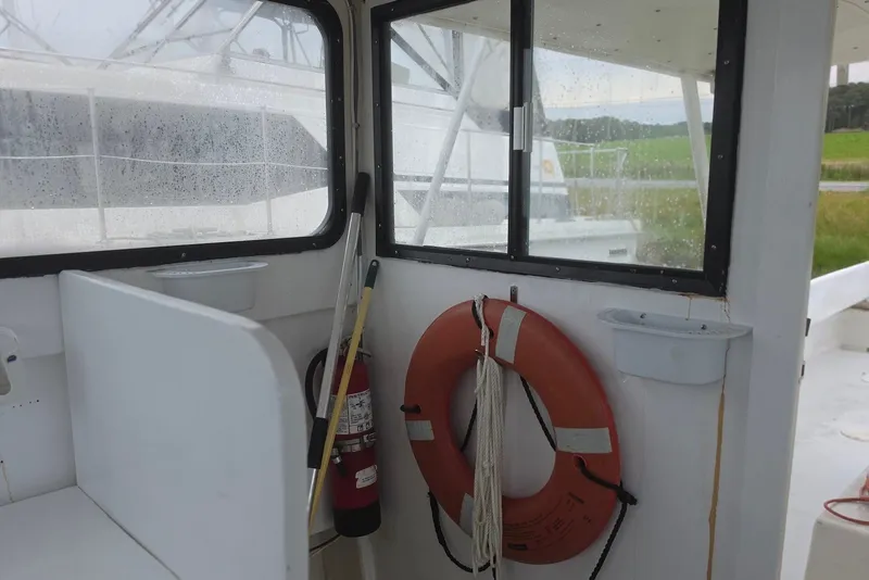 Slide: The Image of 1966 Uniflite Sportfisherman interior with life preserver and fire extinguisher. - 13