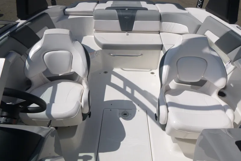 Slide: The Image of 2021 Chaparral 23 SSi boat interior with white seating and modern design. - 6
