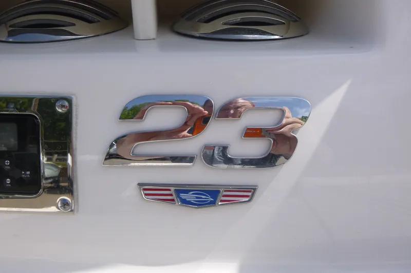 Slide: The Image of Chrome '23' emblem on 2021 Chaparral 23 SSi boat exterior. - 15