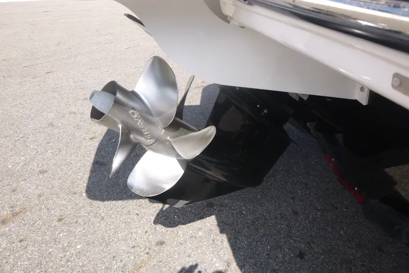 Slide: The Image of 2021 Chaparral 23 SSi boat propeller on pavement background. - 14
