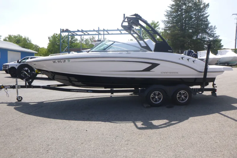 The Image of 2021 Chaparral 23 SSi boat on trailer, parked outdoors. - 1