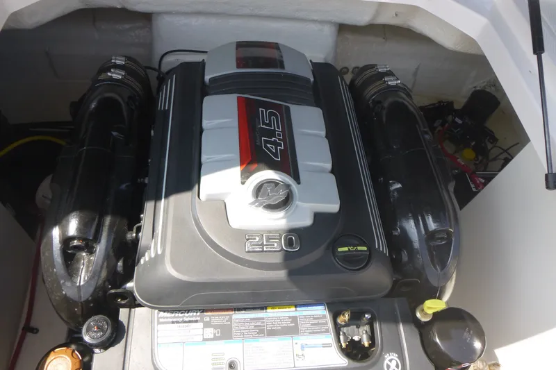 Slide: The Image of 2021 Chaparral 23 SSi boat engine, featuring a Mercury 4.5L 250 horsepower motor. - 13