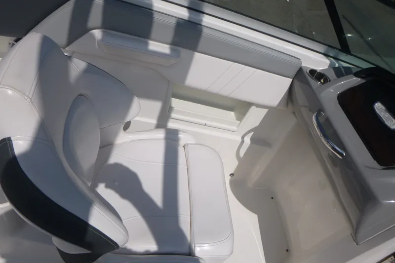 Slide: The Image of Interior of 2021 Chaparral 23 SSi boat featuring white seating and sleek design. - 10
