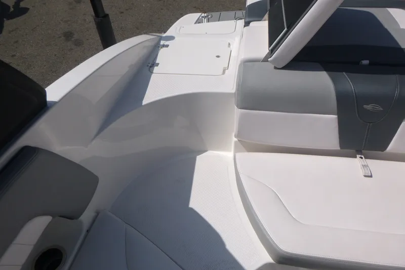 Slide: The Image of 2021 Chaparral 23 SSi boat interior with white and gray seating. - 12