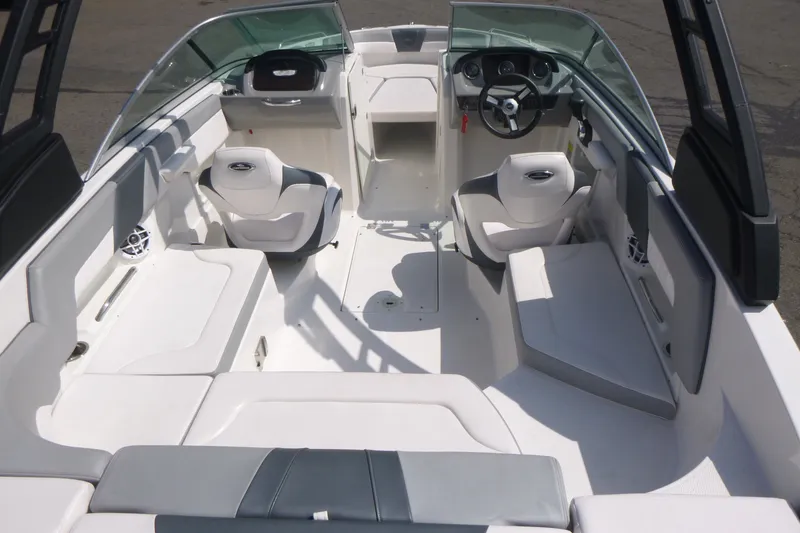 Slide: The Image of 2021 Chaparral 23 SSi boat interior with seating and steering wheel. - 5