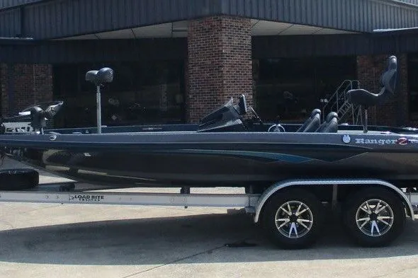 The Image of 2018 Ranger Z519 boat on trailer, sleek design, parked outdoors. - 1