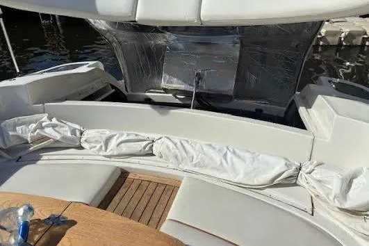 Slide: The Image of 2006 Chris Craft Corsair Heritage boat interior with white seating and wooden deck. - 15