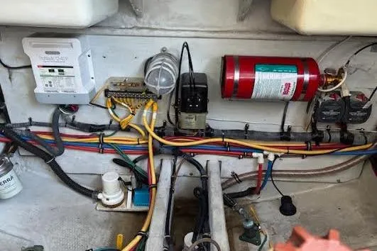 Slide: The Image of Engine compartment of a 2006 Chris Craft Corsair Heritage with wiring and fire extinguisher. - 36