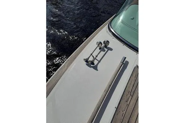 Slide: The Image of 2006 Chris Craft Corsair Heritage boat deck with chrome details and wooden accents. - 20