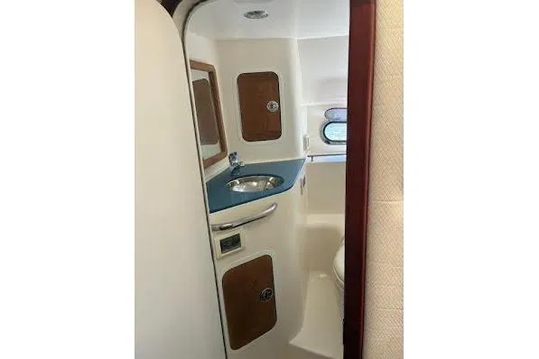 Slide: The Image of 2006 Chris Craft Corsair Heritage boat interior with sink and storage cabinets. - 29