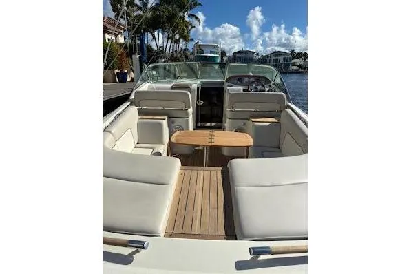 Slide: The Image of 2006 Chris Craft Corsair Heritage boat interior with elegant seating and wooden deck. - 13
