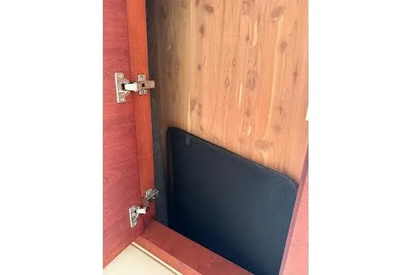 Slide: The Image of Open wooden cabinet door on 2006 Chris Craft Corsair Heritage boat. - 25