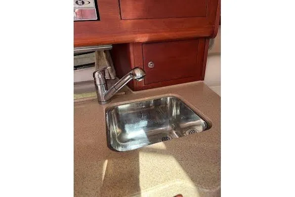 Slide: The Image of 2006 Chris Craft Corsair Heritage boat interior with sink and wooden cabinetry. - 18