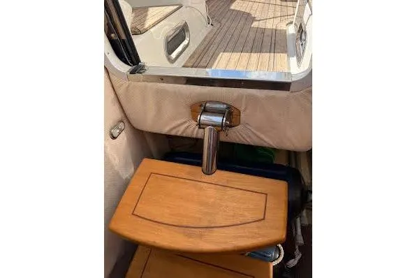 Slide: The Image of 2006 Chris Craft Corsair Heritage boat interior with wooden steps and chrome details. - 23