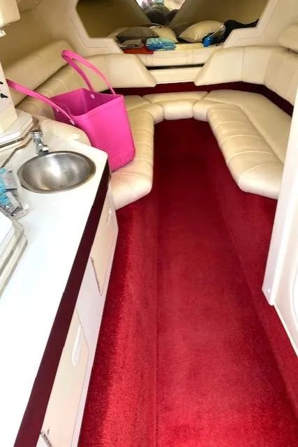 Slide: The Image of Interior of 2006 Fountain 42 Executioner boat with red carpet and beige seating. - 9