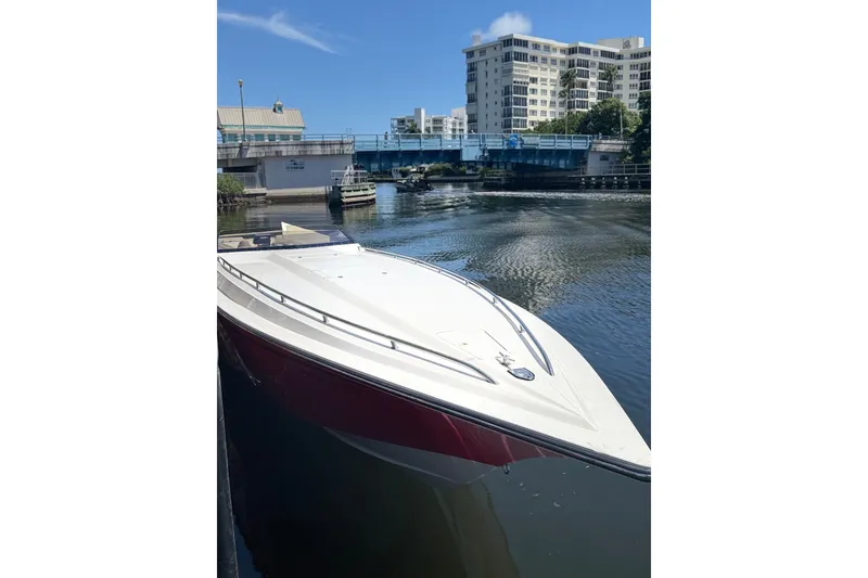 Slide: The Image of 2006 Fountain 42 Executioner boat docked near a bridge on a sunny day. - 28