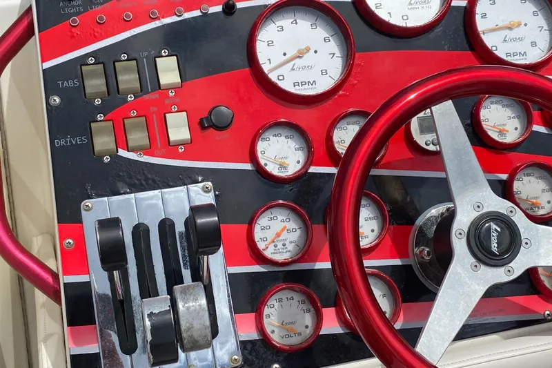 Slide: The Image of 2006 Fountain 42 Executioner dashboard with gauges, red accents, and steering wheel. - 4