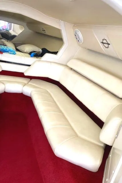 Slide: The Image of 2006 Fountain 42 Executioner interior with white leather seating and red carpet. - 10