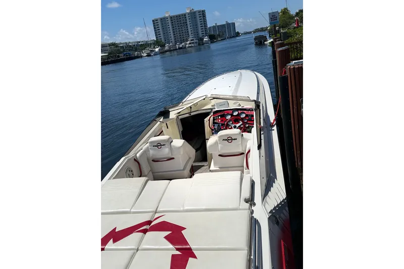 Slide: The Image of 2006 Fountain 42 Executioner speedboat docked by waterfront buildings. - 29