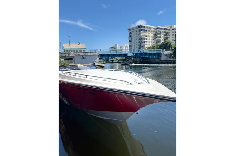 Slide: The Image of 2006 Fountain 42 Executioner boat docked near a bridge on a sunny day. - 30