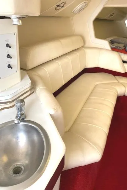 Slide: The Image of 2006 Fountain 42 Executioner interior with cream leather seating and stainless steel sink. - 13