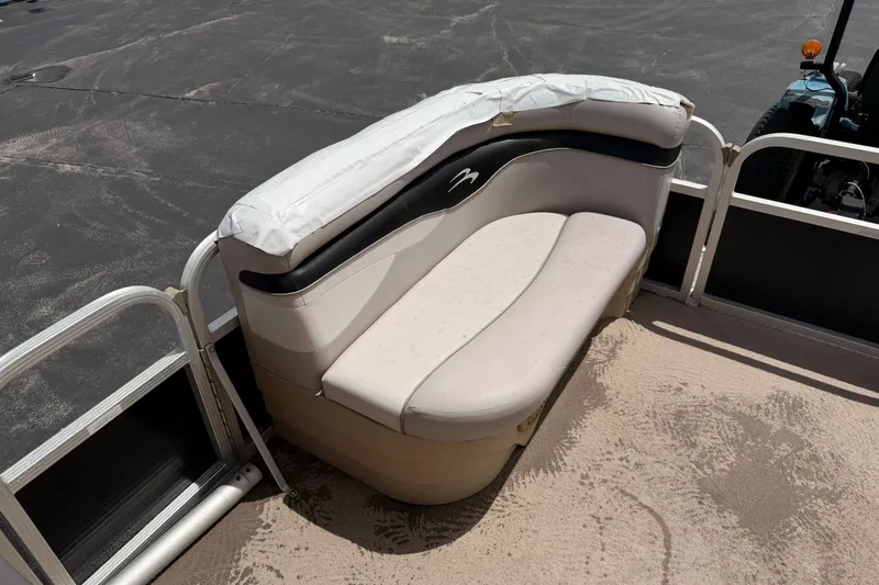 Slide: The Image of 2011 Bennington 20SLi pontoon boat with cushioned seating and railing. - 15
