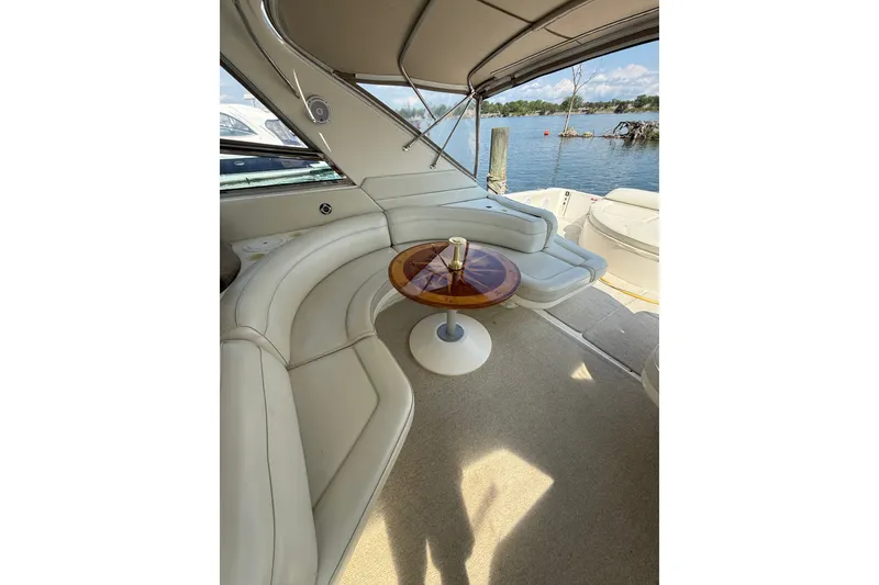 Slide: The Image of Luxurious 1991 Sea Ray 630 Super Sun Sport yacht interior with elegant seating and table. - 20