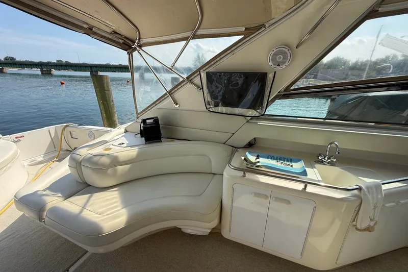 Slide: The Image of Luxurious interior of 1991 Sea Ray 630 Super Sun Sport yacht with waterfront view. - 19