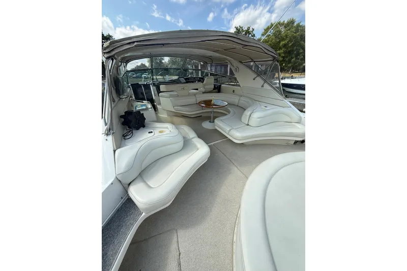 Slide: The Image of Luxurious interior of 1991 Sea Ray 630 Super Sun Sport yacht with plush seating. - 14