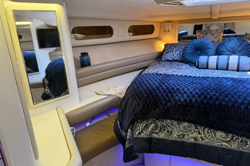 Slide: The Image of Luxurious cabin interior of 1991 Sea Ray 630 Super Sun Sport yacht with elegant bedding. - 44