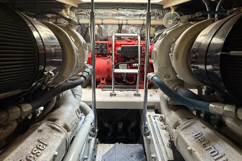 Slide: The Image of Engine room of a 1991 Sea Ray 630 Super Sun Sport yacht, featuring Detroit Diesel engines. - 56