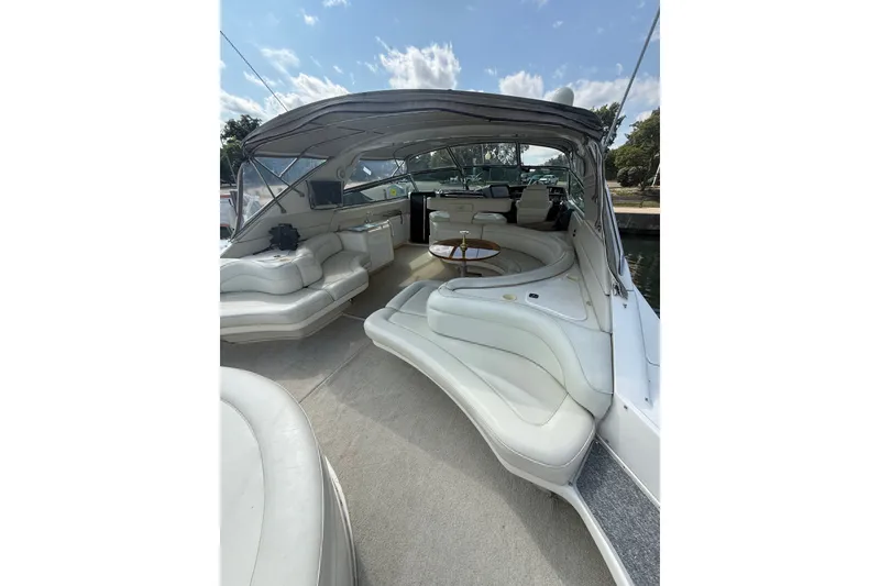 Slide: The Image of Luxurious 1991 Sea Ray 630 Super Sun Sport yacht interior with plush seating and elegant design. - 13