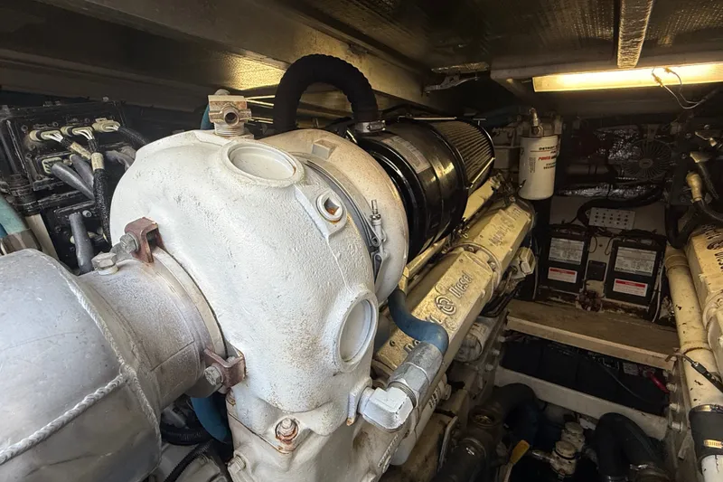 Slide: The Image of Engine room of a 1991 Sea Ray 630 Super Sun Sport yacht, showcasing mechanical components. - 52