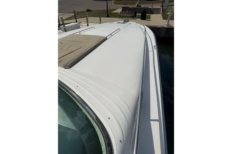 Slide: The Image of 1991 Sea Ray 630 Super Sun Sport yacht deck view at dockside. - 7