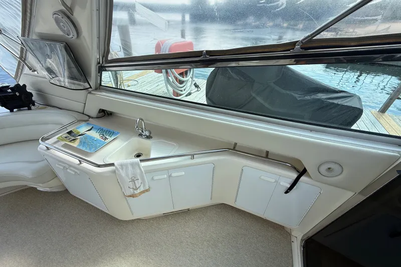 Slide: The Image of Interior of 1991 Sea Ray 630 Super Sun Sport yacht with sink and storage cabinets. - 18