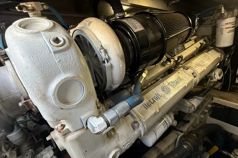 Slide: The Image of Engine of a 1991 Sea Ray 630 Super Sun Sport yacht, featuring Detroit Diesel components. - 54