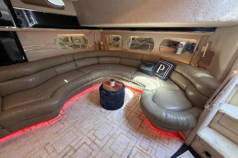 Slide: The Image of Luxurious 1991 Sea Ray 630 Super Sun Sport yacht interior with plush seating and ambient lighting. - 28