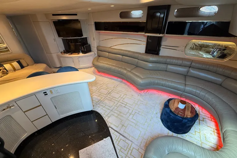 Slide: The Image of Luxurious interior of 1991 Sea Ray 630 Super Sun Sport yacht with plush seating and modern decor. - 27