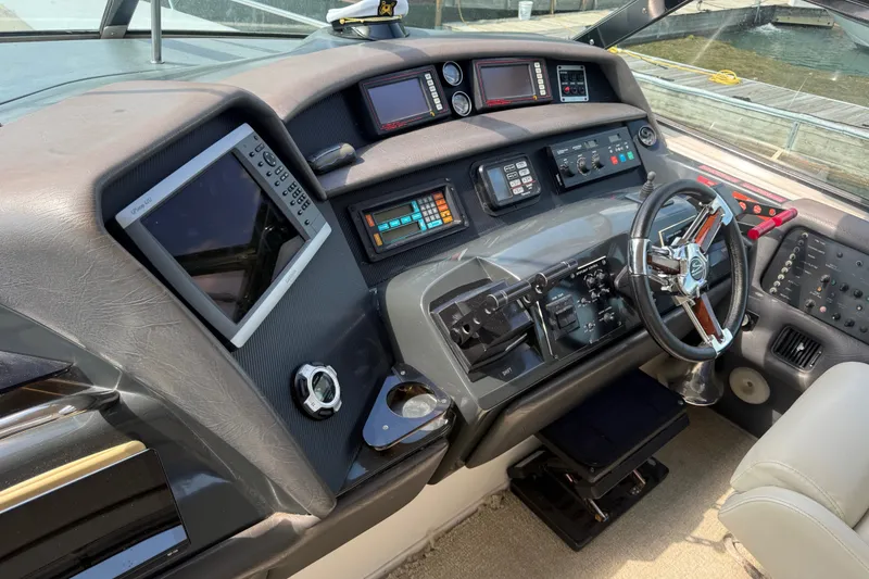 Slide: The Image of Cockpit of 1991 Sea Ray 630 Super Sun Sport with advanced navigation controls. - 24