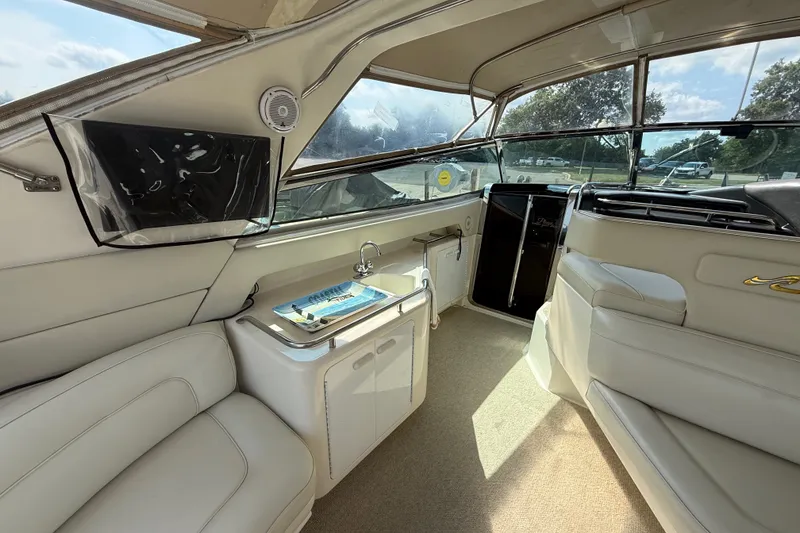 Slide: The Image of Luxurious interior of 1991 Sea Ray 630 Super Sun Sport yacht with plush seating. - 16