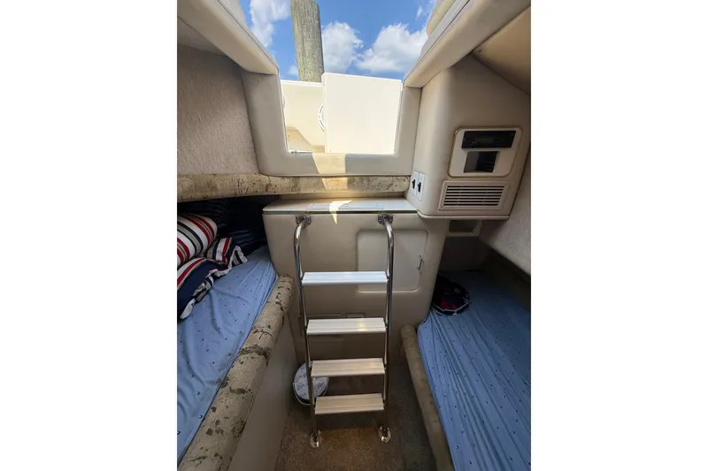 Slide: The Image of Interior cabin of 1991 Sea Ray 630 Super Sun Sport with ladder and bedding. - 47