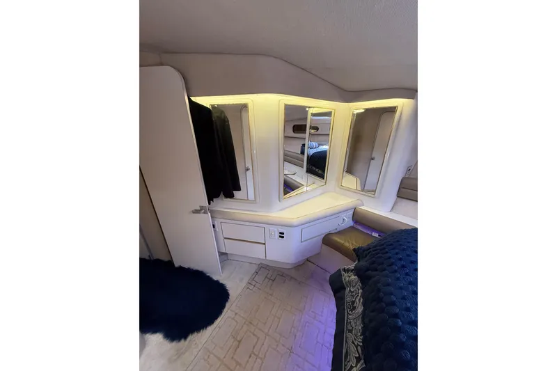 Slide: The Image of Luxurious interior of 1991 Sea Ray 630 Super Sun Sport yacht with elegant lighting and mirrors. - 42