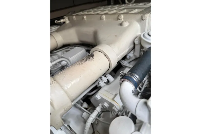 Slide: The Image of Engine components of a 2004 Sea Ray 550 Sundancer boat, showcasing detailed mechanical parts. - 60