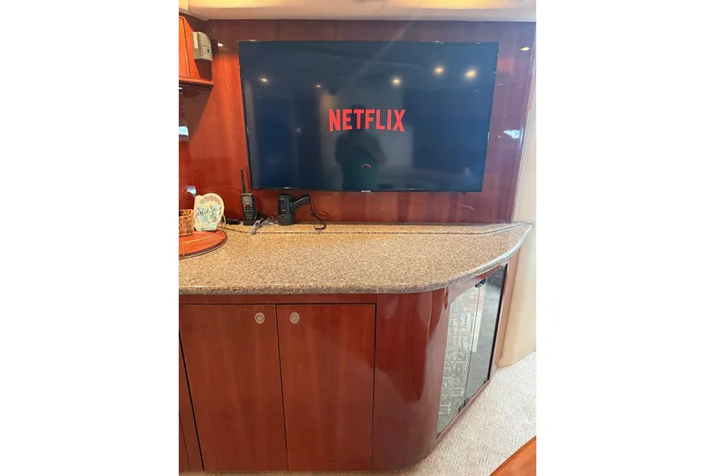 Slide: The Image of Luxurious interior of 2004 Sea Ray 550 Sundancer with TV displaying Netflix. - 95