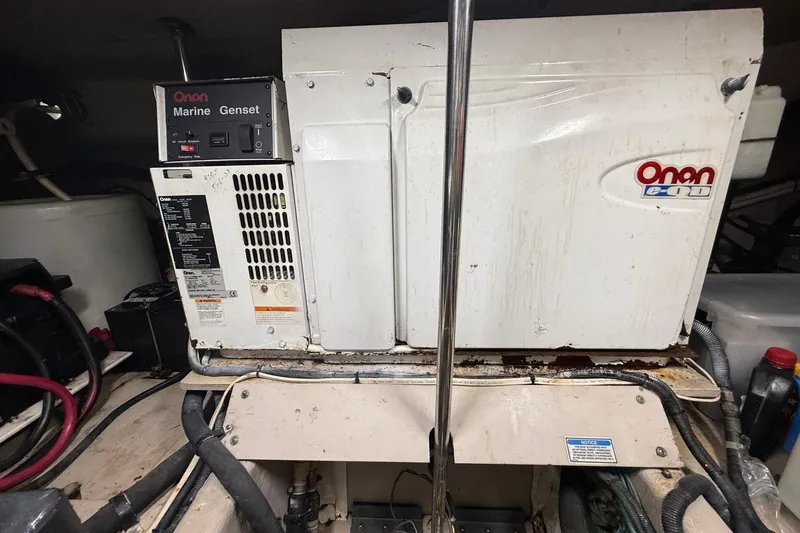 Slide: The Image of Onan marine generator inside a 2004 Sea Ray 550 Sundancer yacht engine room. - 64