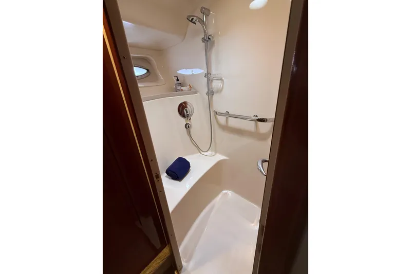 Slide: The Image of Shower area in 2004 Sea Ray 550 Sundancer yacht, featuring modern fixtures and compact design. - 89