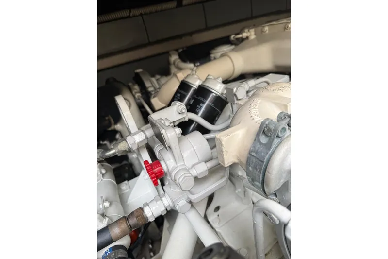 Slide: The Image of Engine components of a 2004 Sea Ray 550 Sundancer boat, featuring detailed mechanical parts. - 59