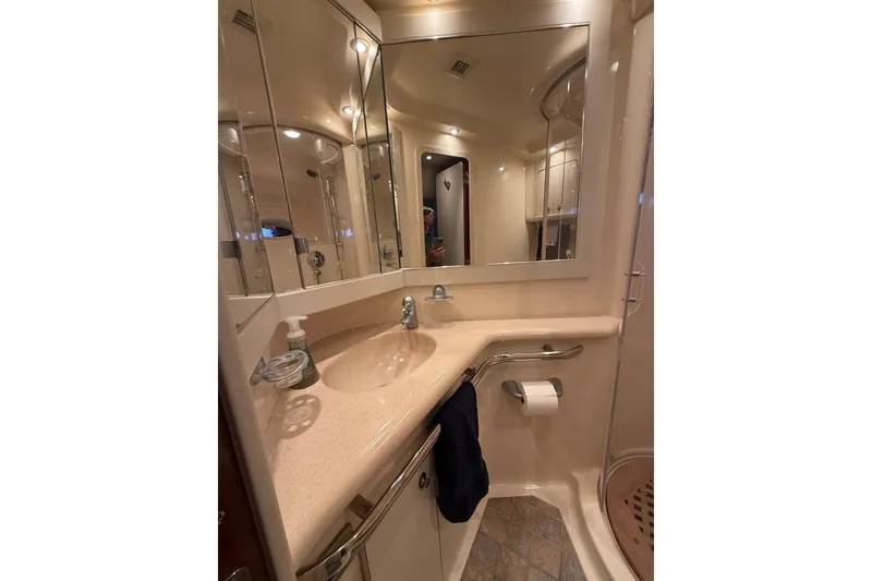 Slide: The Image of Luxurious bathroom interior of 2004 Sea Ray 550 Sundancer yacht with elegant fixtures. - 105
