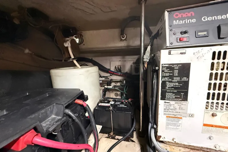 Slide: The Image of Engine room of 2004 Sea Ray 550 Sundancer with Onan marine generator and batteries. - 66
