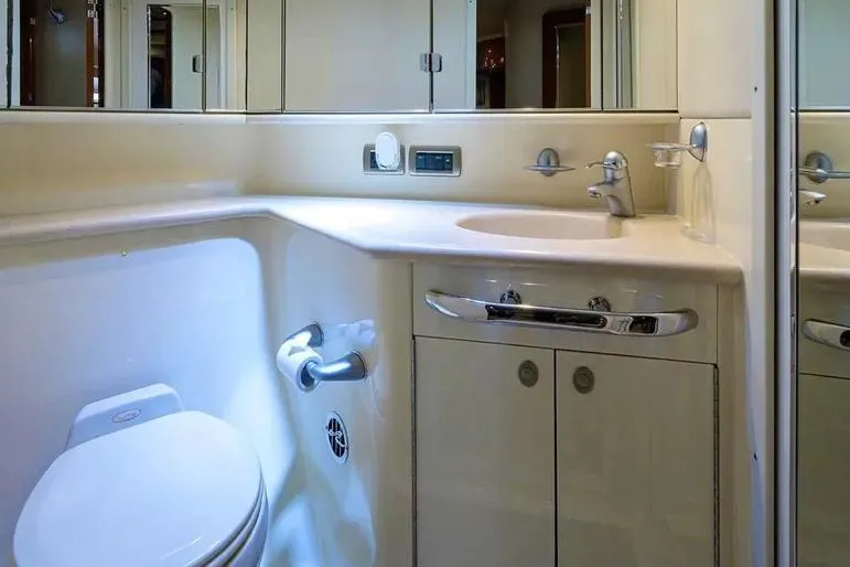 Slide: The Image of Luxurious bathroom in 2004 Sea Ray 550 Sundancer yacht, featuring modern fixtures and cabinetry. - 36